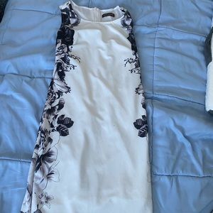 White dress with floral black detail